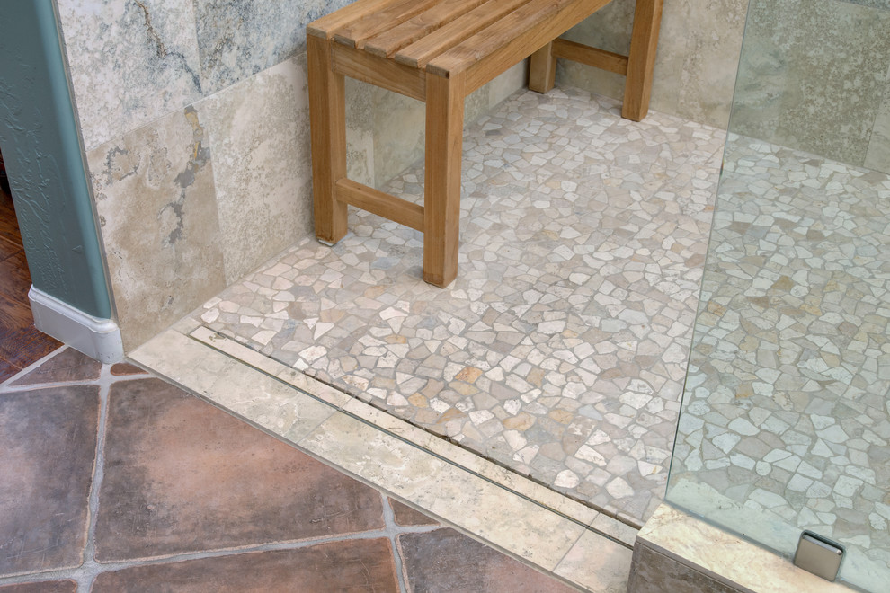 Example of a large transitional master gray tile and stone tile ceramic tile walk-in shower design in Phoenix with an undermount sink, raised-panel cabinets, dark wood cabinets, granite countertops and blue walls
