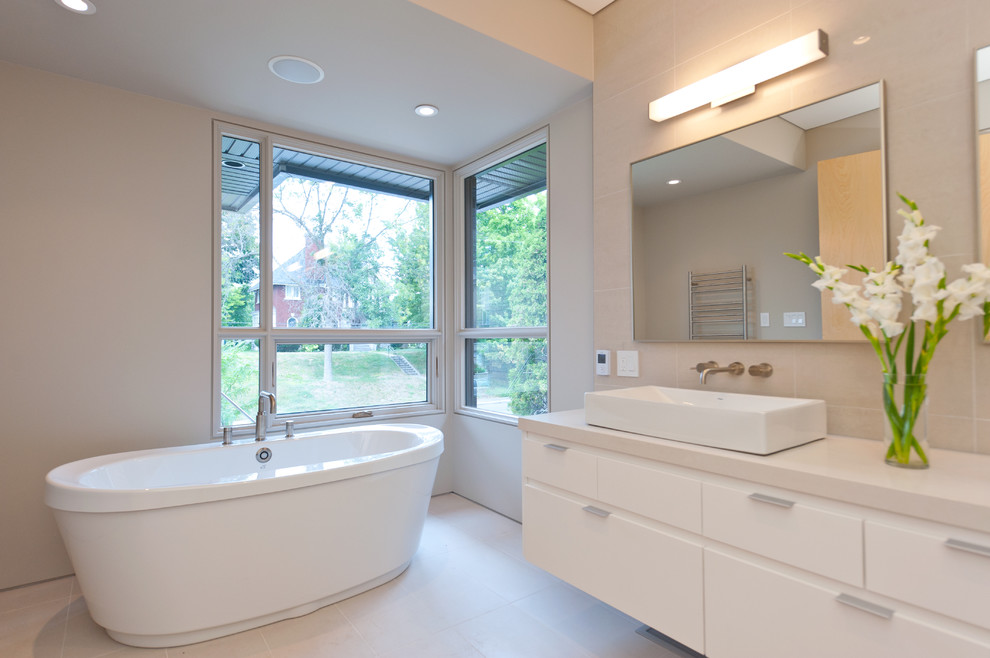 Inspiration for a large modern master bathroom in Ottawa with a vessel sink, flat-panel cabinets and light wood cabinets.