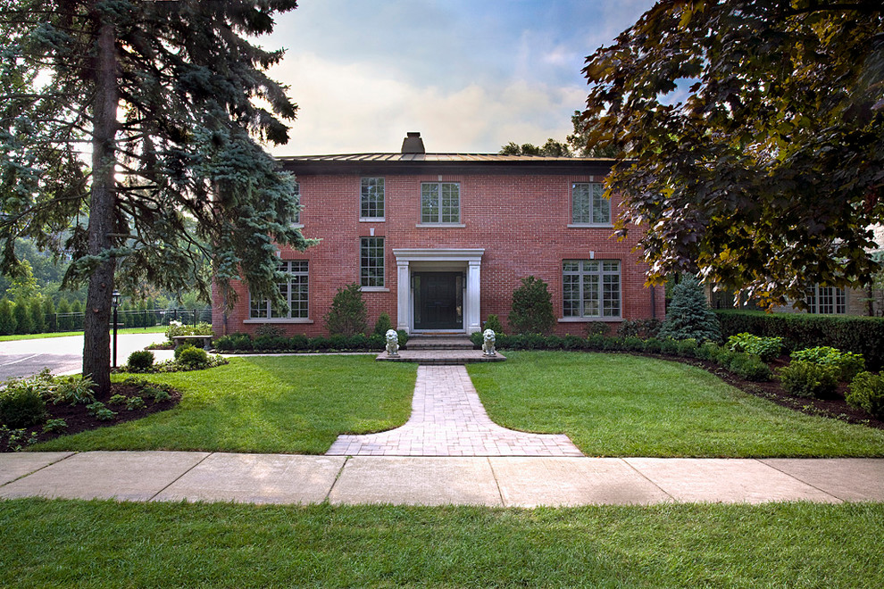 Expansive traditional two-storey brick red exterior in Chicago.