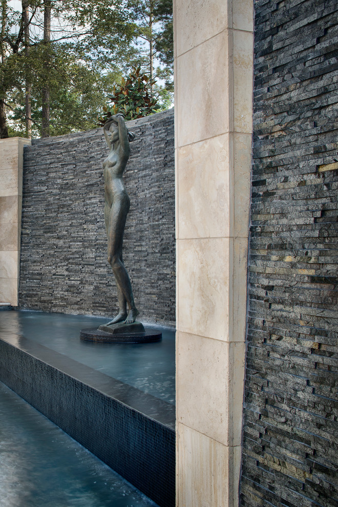 Pool fountain - huge transitional backyard custom-shaped pool fountain idea in Houston