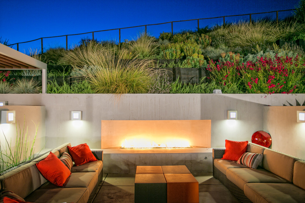 This is an example of a contemporary patio in San Francisco with with fireplace.