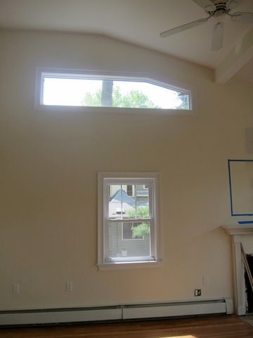 Window treatments for different height windows in one open space