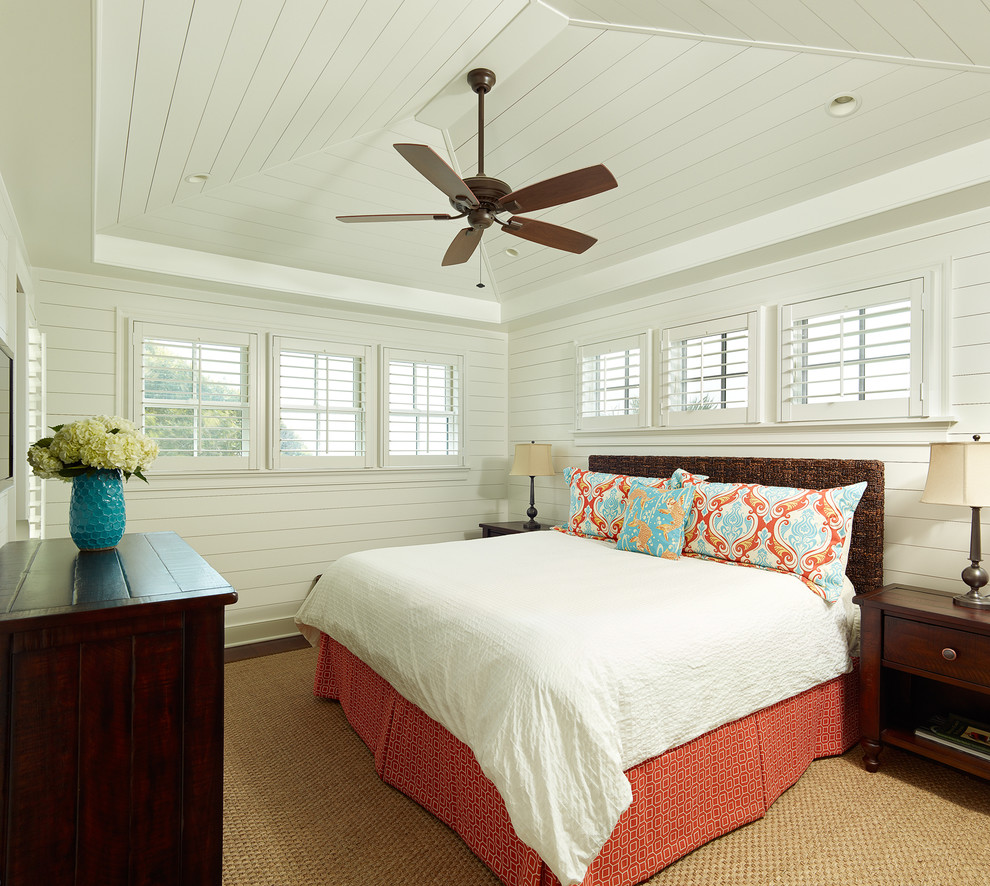 Photo of a tropical bedroom in Charleston with white walls.