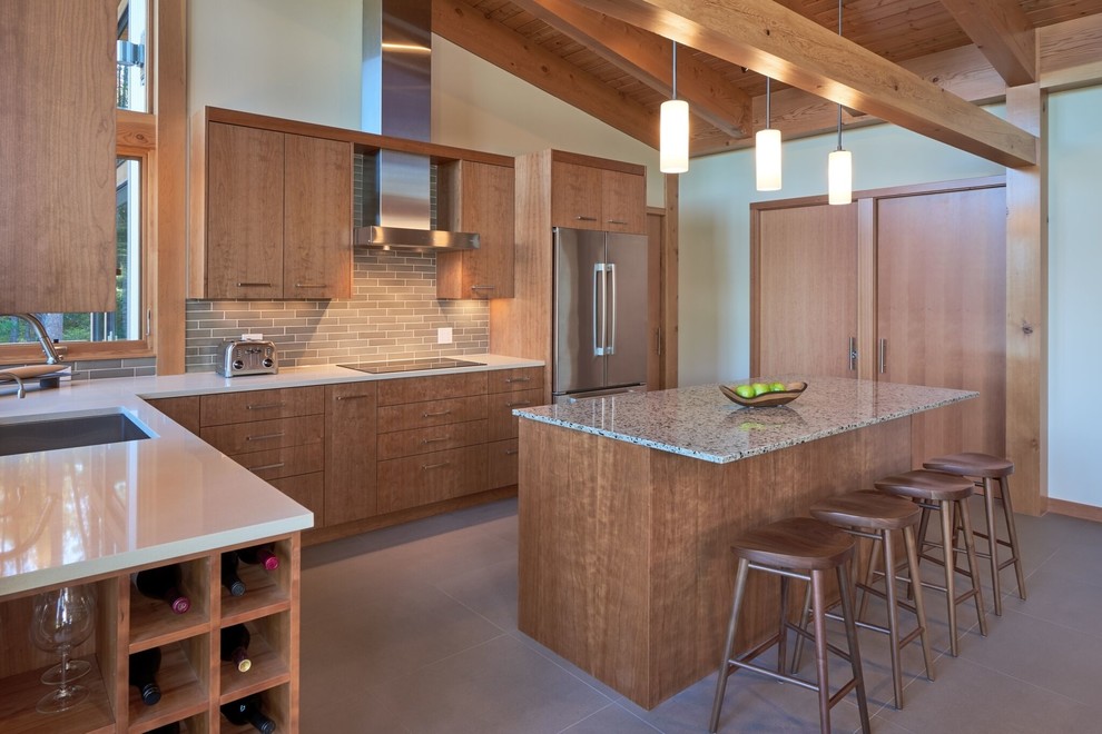 Inspiration for a large contemporary u-shaped eat-in kitchen in Orange County with a drop-in sink, flat-panel cabinets, light wood cabinets, granite benchtops, grey splashback, subway tile splashback, stainless steel appliances, ceramic floors and with island.
