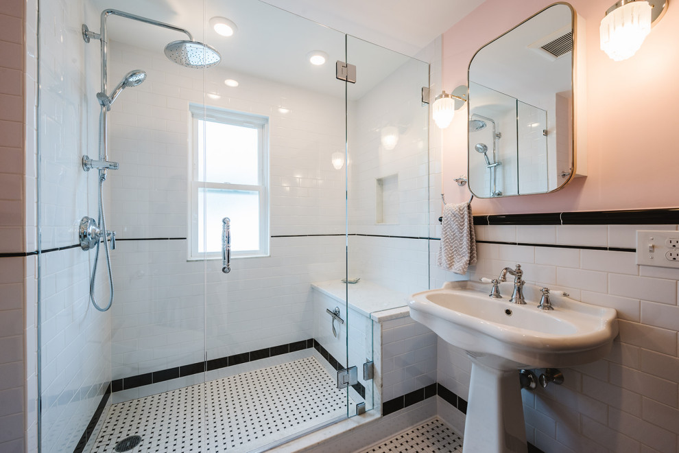 Small victorian ensuite bathroom in Boston with a walk-in shower, a bidet, black and white tiles, metro tiles, pink walls, porcelain flooring, a pedestal sink, a hinged door and a shower bench.