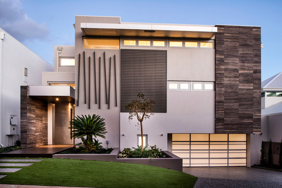Photo of an expansive contemporary three-storey beige exterior in Perth with mixed siding and a flat roof.