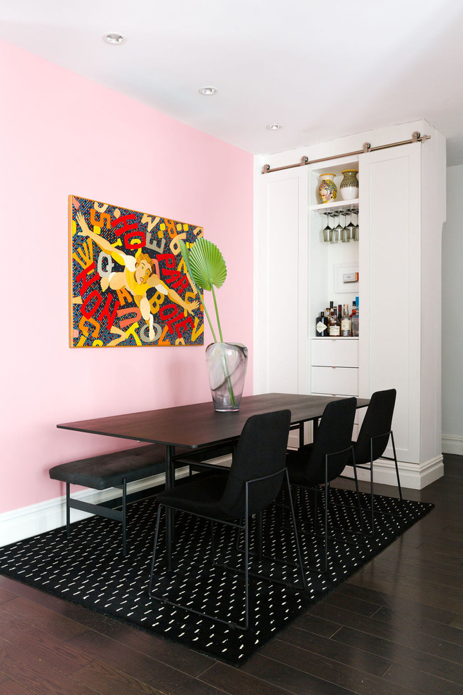 Inspiration for a mid-sized contemporary dining room in New York with pink walls, dark hardwood floors and brown floor.
