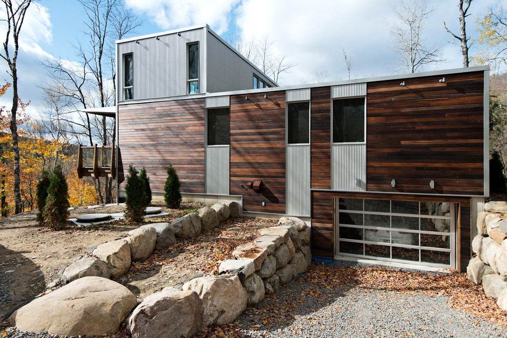 This is an example of a contemporary exterior in Montreal with metal siding.