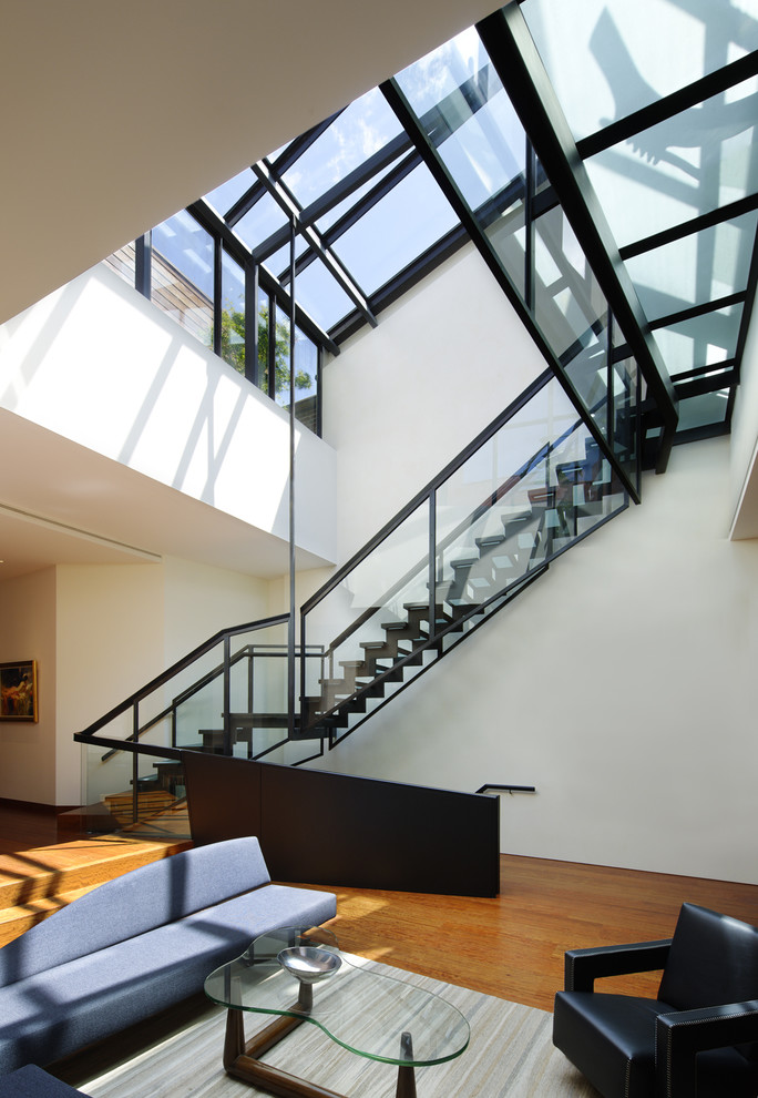 Inspiration for an expansive contemporary glass u-shaped staircase in New York with open risers.