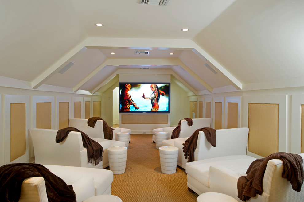 This is an example of a large tropical enclosed home theatre in Orlando with white walls, carpet and a wall-mounted tv.