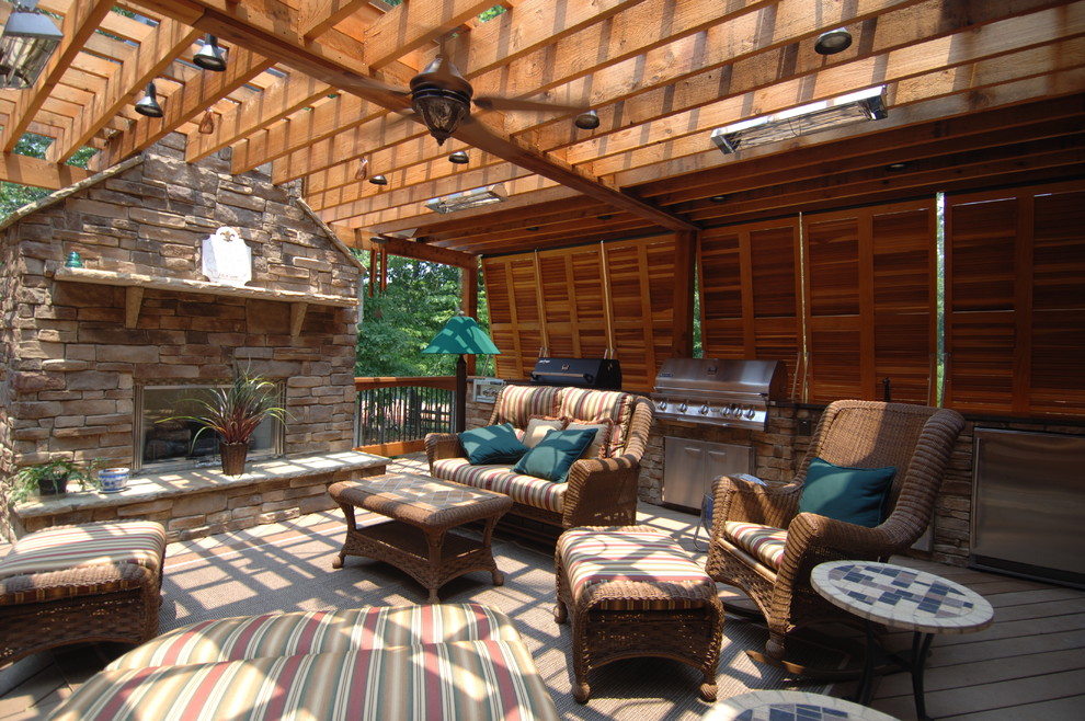 Inspiration for a huge rustic backyard outdoor kitchen deck remodel in Atlanta with a pergola