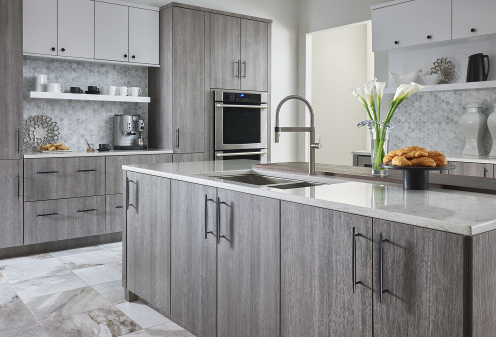 Kitchen - large transitional u-shaped gray floor kitchen idea in Seattle with an undermount sink, medium tone wood cabinets, gray backsplash, an island and gray countertops