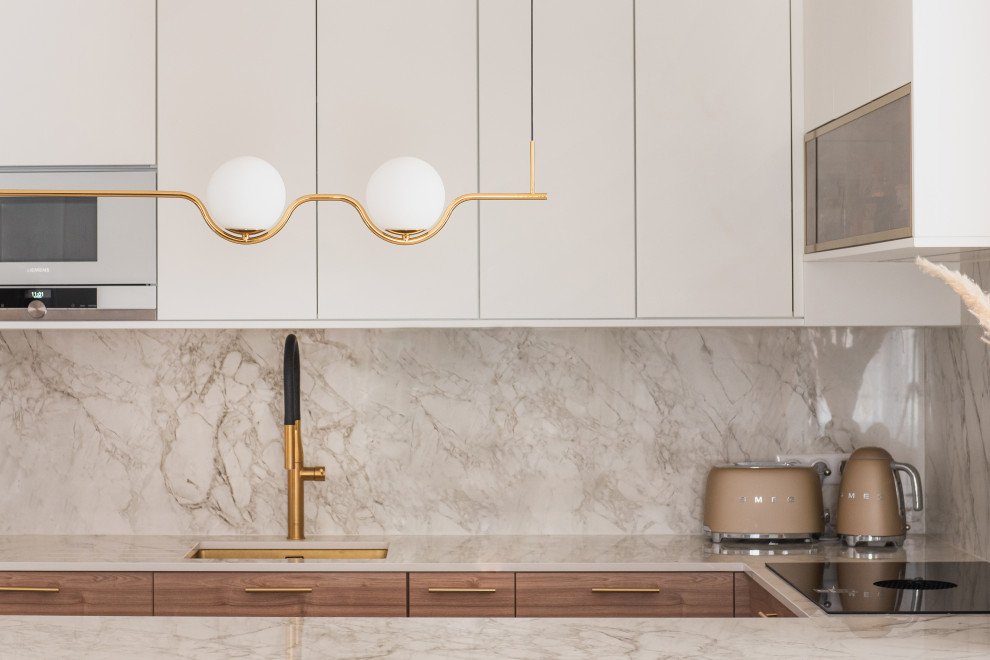 Photo of a medium sized modern u-shaped open plan kitchen in Paris with a single-bowl sink, white cabinets, marble worktops, white splashback, marble splashback, light hardwood flooring and white worktops.