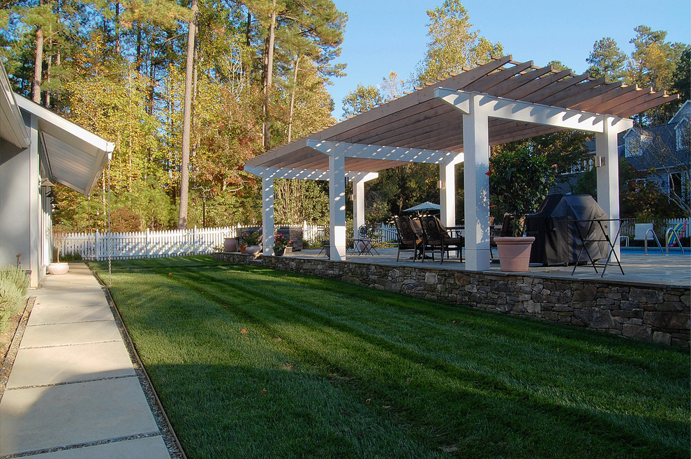 Pool house - transitional side yard stone and rectangular lap pool house idea in Raleigh
