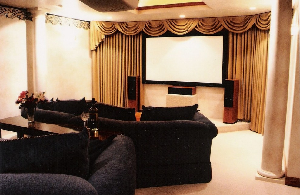 Photo of a transitional home theatre in Denver.