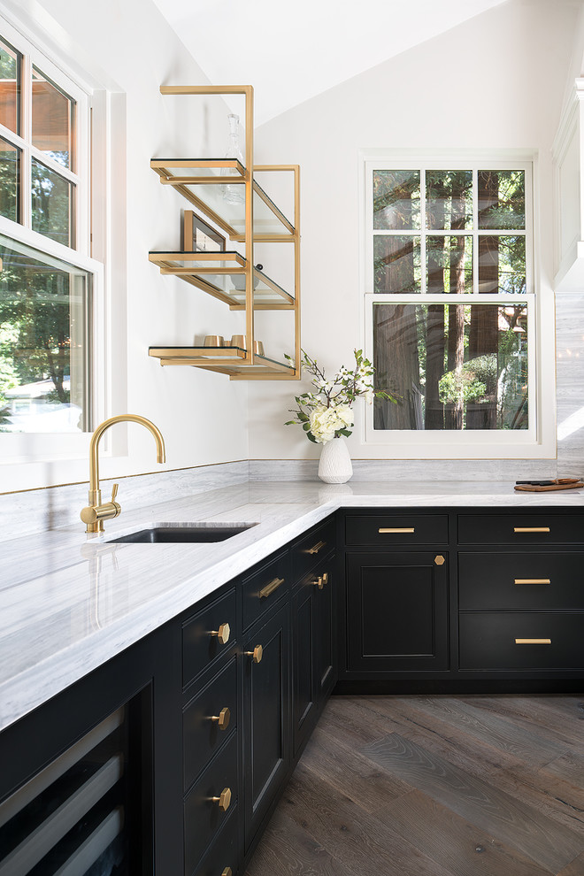 Design ideas for a mid-sized transitional u-shaped eat-in kitchen in San Francisco with panelled appliances, black cabinets, marble benchtops, grey splashback, with island, an undermount sink, open cabinets, stone slab splashback, medium hardwood floors and beige floor.