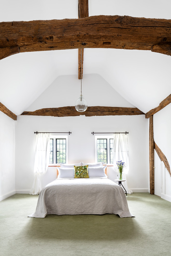 This is an example of a country bedroom in Surrey.