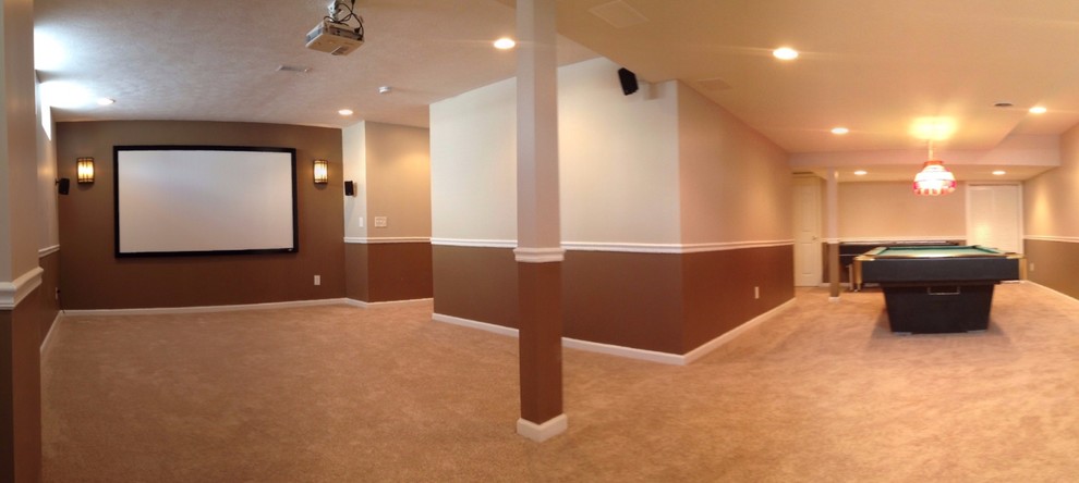 Design ideas for a large traditional home theatre in Cleveland with multi-coloured walls and carpet.