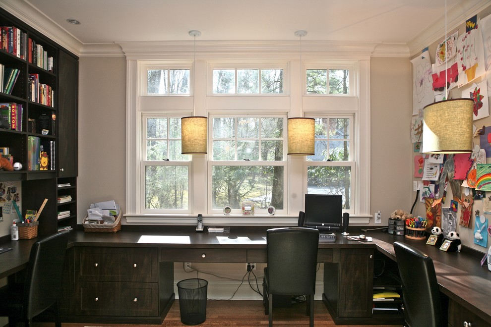 Photo of a contemporary home office in Boston with a built-in desk.