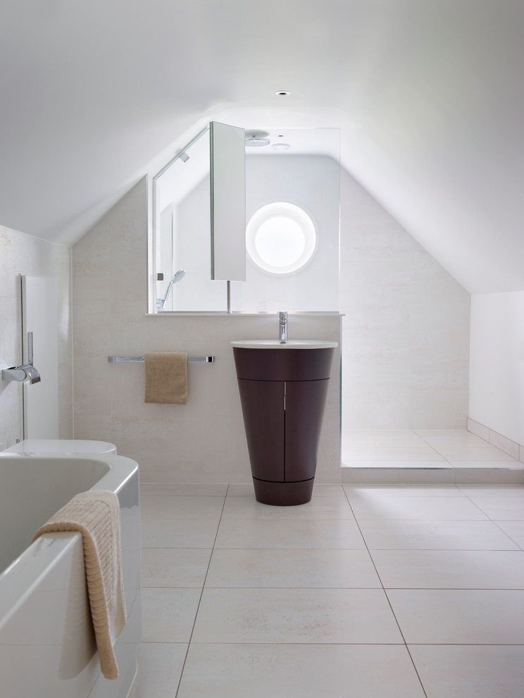 Inspiration for a large contemporary master bathroom in Surrey with a pedestal sink, flat-panel cabinets, dark wood cabinets, an alcove shower, a wall-mount toilet, white tile, porcelain tile, white walls and ceramic floors.