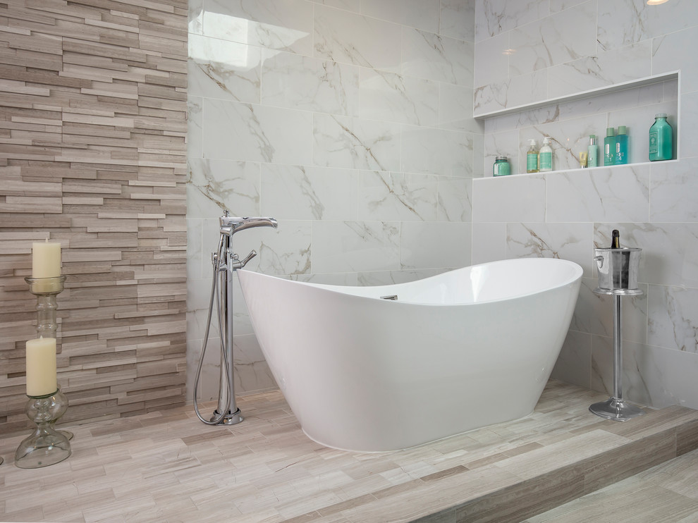 Design ideas for an expansive contemporary master bathroom in Los Angeles with recessed-panel cabinets, dark wood cabinets, a freestanding tub, an open shower, a two-piece toilet, gray tile, porcelain tile, white walls, limestone floors, a drop-in sink, engineered quartz benchtops, grey floor and an open shower.