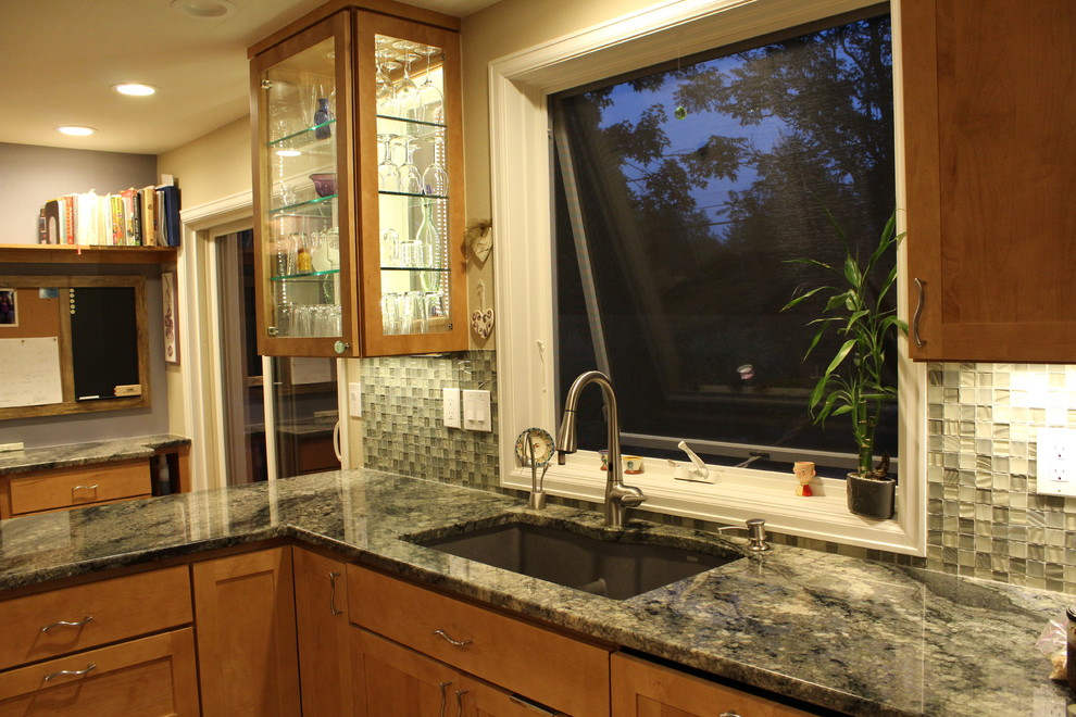 Small transitional light wood floor kitchen photo in Denver with an undermount sink, recessed-panel cabinets, light wood cabinets, granite countertops, green backsplash, glass tile backsplash, stainless steel appliances and no island