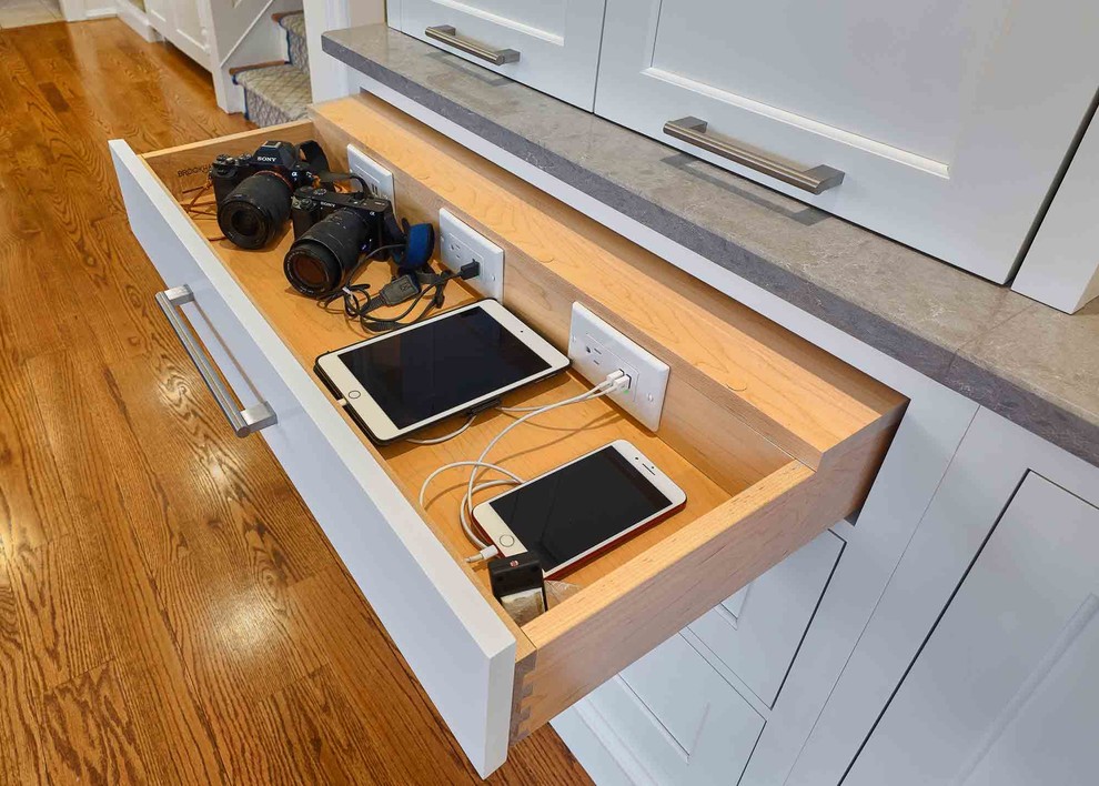 Example of a large transitional l-shaped medium tone wood floor and brown floor eat-in kitchen design in Bridgeport with a drop-in sink, beaded inset cabinets, white cabinets, limestone countertops, white backsplash, ceramic backsplash, stainless steel appliances, an island and gray countertops