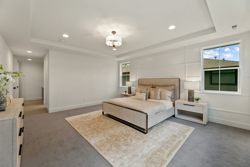 Photo of a large rural master bedroom in Seattle with white walls, carpet, grey floors and a drop ceiling.
