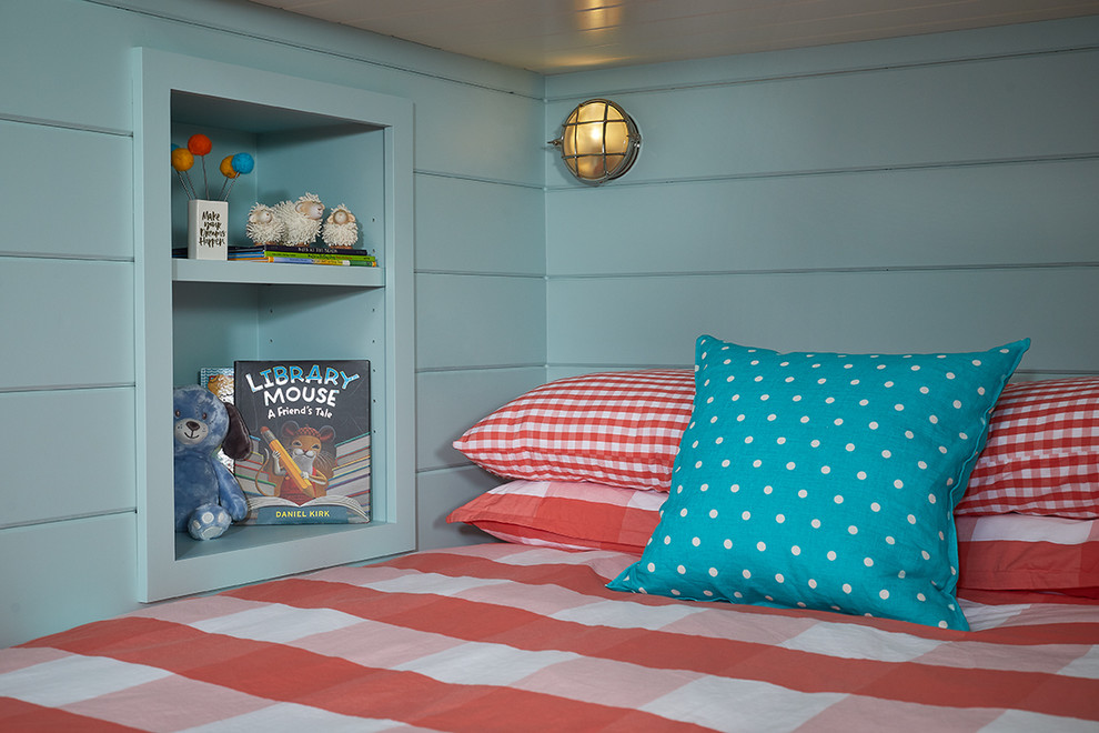Beach House Bunk Room - In this formerly unfinished room above a garage, we were tasked with creating the ultimate kids’ space that could easily be used for adult guests as well. Our space was limited, but our client’s imagination wasn’t! Bold, fun, summertime colors, layers of pattern, and a strong emphasis on architectural details make for great vignettes at every turn.

With many collaborations and revisions, we created a space that sleeps 8, offers a game/project table, a cozy reading space, and a full bathroom. The game table and banquette, bathroom vanity, locker wall, and unique bunks were custom designed by Bayberry Cottage and all allow for tons of clever storage spaces.

This is a space created for loved ones and a lifetime of memories of a fabulous lakefront vacation home!