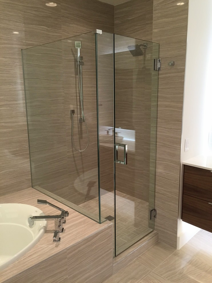 Corner shower - transitional master beige tile and marble tile marble floor and beige floor corner shower idea with a hinged shower door