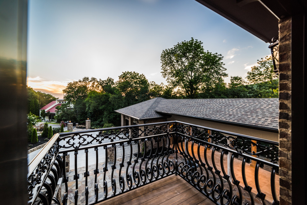 Inspiration for a mid-sized rustic metal railing balcony remodel with no cover