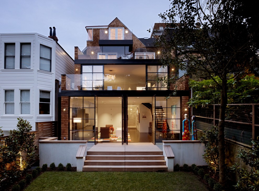 Transitional three-storey exterior in San Francisco with wood siding.