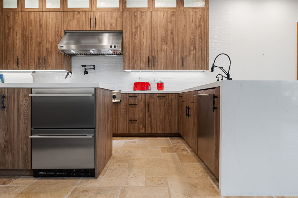 Mountain style l-shaped slate floor and beige floor enclosed kitchen photo with a single-bowl sink, flat-panel cabinets, medium tone wood cabinets, quartzite countertops, white backsplash, glass sheet backsplash, stainless steel appliances, a peninsula and white countertops