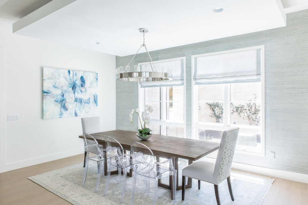 Example of a transitional light wood floor and beige floor dining room design in Austin with gray walls