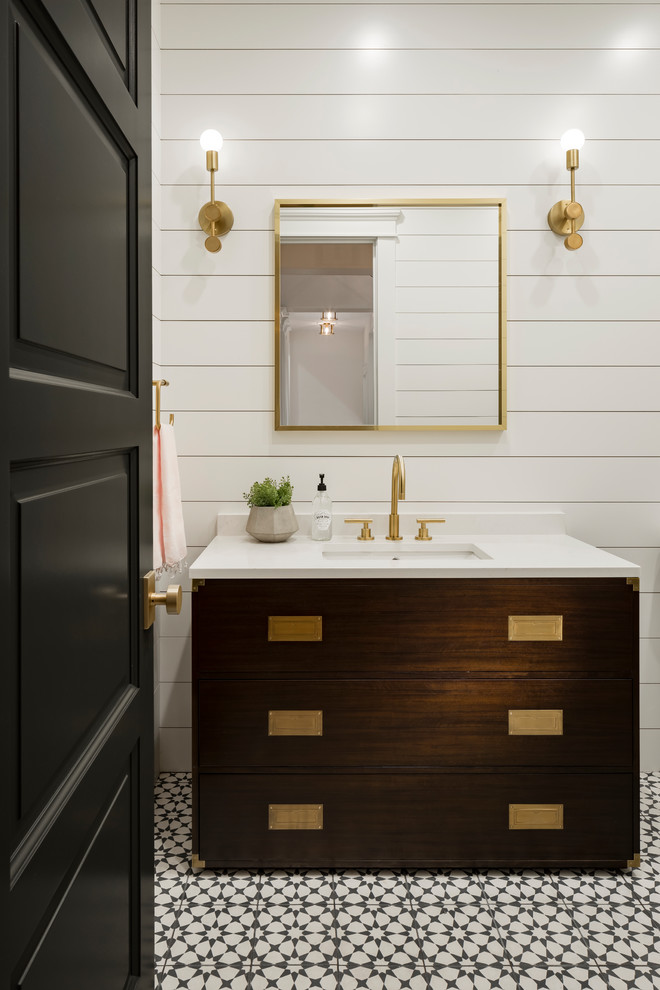 Doorless shower - large transitional 3/4 white tile cement tile floor and black floor doorless shower idea in Phoenix with recessed-panel cabinets, brown cabinets, a one-piece toilet, white walls, an undermount sink and quartz countertops