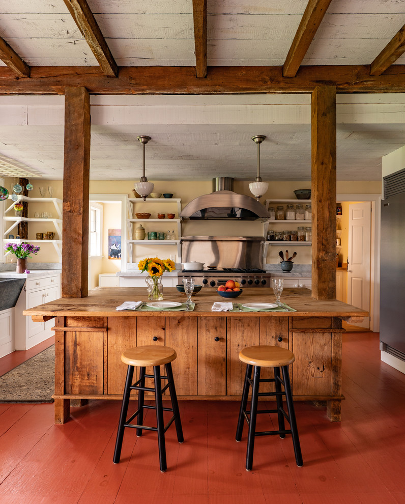 Inspiration for a large country kitchen in Boston with a farmhouse sink, open cabinets, white cabinets, wood benchtops, metallic splashback, stainless steel appliances, painted wood floors, with island and red floor.