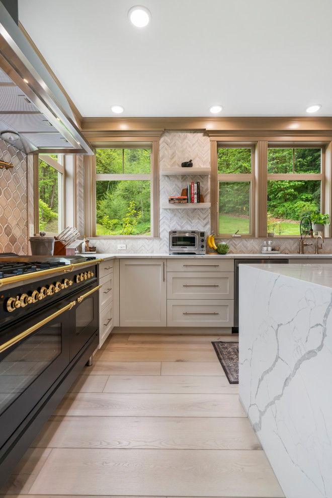 Inspiration for a large classic u-shaped enclosed kitchen in Seattle with a built-in sink, beaded cabinets, white cabinets, marble worktops, beige splashback, ceramic splashback, stainless steel appliances, vinyl flooring, an island, beige floors, white worktops and a coffered ceiling.