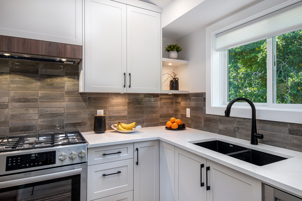 Example of a transitional kitchen design in Vancouver