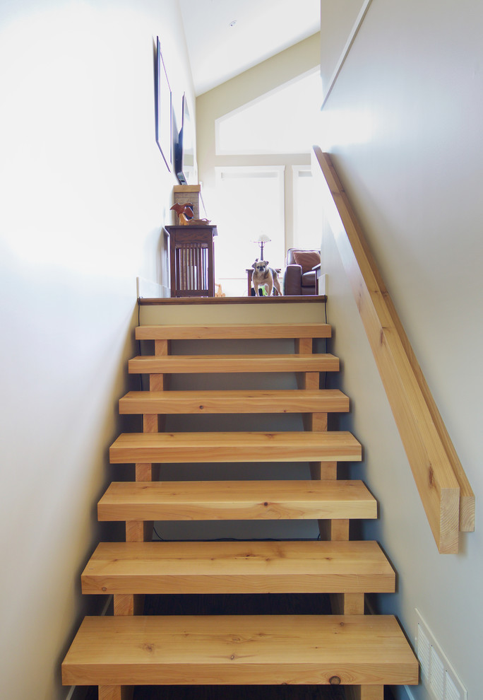 Inspiration for a traditional wood straight staircase in Vancouver with open risers.