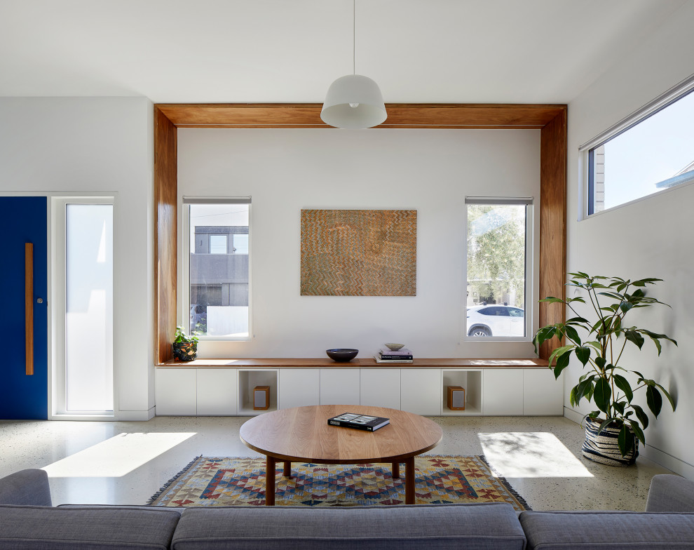 This is an example of a mid-sized scandinavian open concept living room in Melbourne with concrete floors and grey floor.