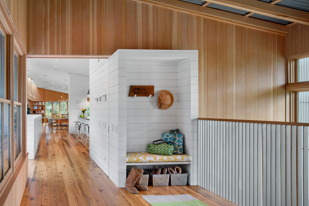 Contemporary mudroom in San Francisco with white walls and medium hardwood floors.