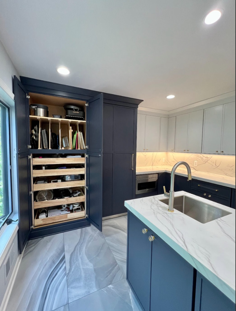 Contemporary single-wall enclosed kitchen in Detroit with flat-panel cabinets, blue cabinets, granite worktops, white splashback, granite splashback, integrated appliances, porcelain flooring, blue floors and white worktops.
