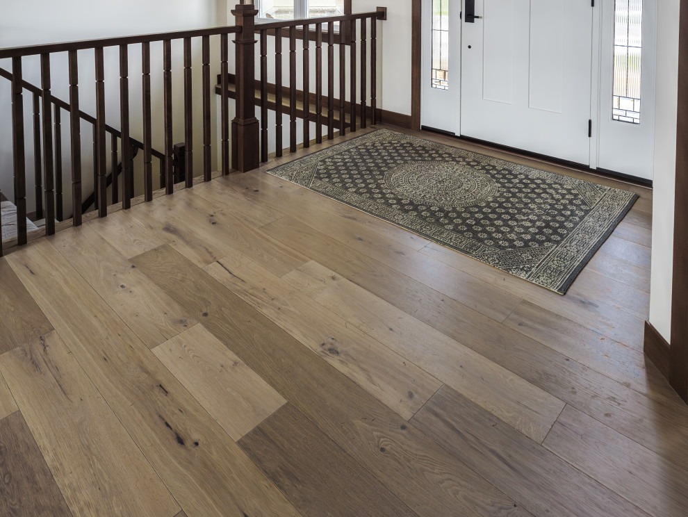 Example of a transitional light wood floor and beige floor front door design with a white front door