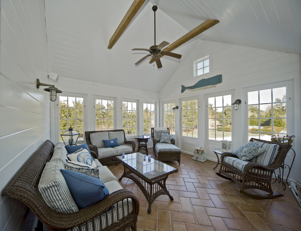 Photo of a beach style sunroom in Boston with terra-cotta floors, a standard ceiling and orange floor.