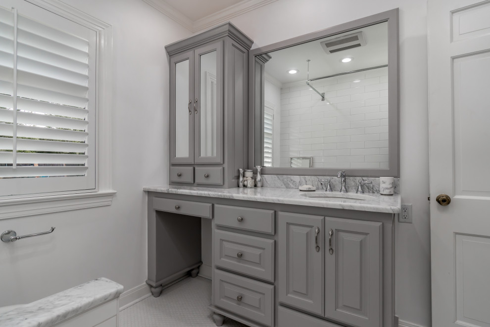 Design ideas for a small traditional bathroom in Other with raised-panel cabinets, grey cabinets, an alcove tub, a shower/bathtub combo, a two-piece toilet, white tile, ceramic tile, white walls, ceramic floors, an undermount sink, marble benchtops, white floor, a shower curtain, white benchtops, a single vanity and a built-in vanity.
