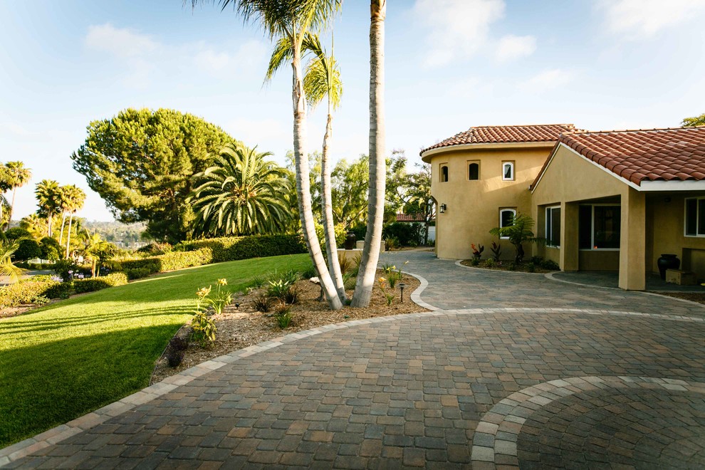 Design ideas for a large traditional backyard patio in San Diego with a fire feature and concrete pavers.