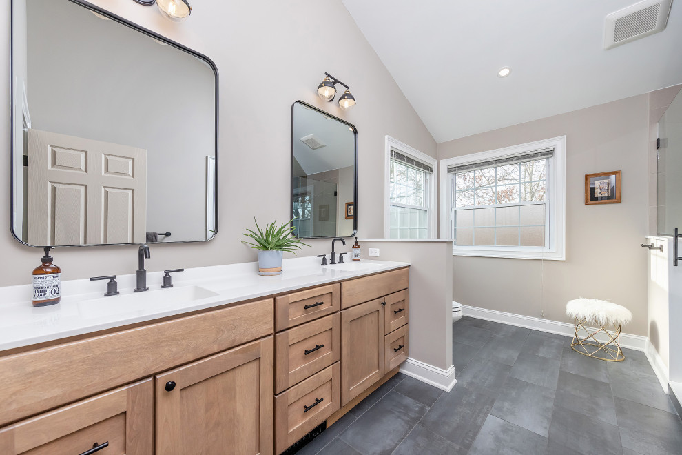 Mid-sized transitional bathroom in Philadelphia with shaker cabinets, medium wood cabinets, a double shower, ceramic tile, ceramic floors, an undermount sink, grey floor, a hinged shower door, white benchtops, a shower seat, a double vanity, a built-in vanity and vaulted.