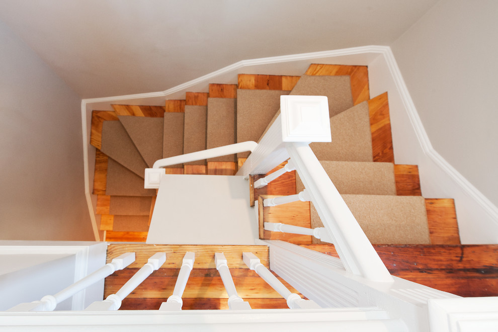 Design ideas for a mid-sized contemporary carpeted u-shaped staircase in Boston with concrete risers.