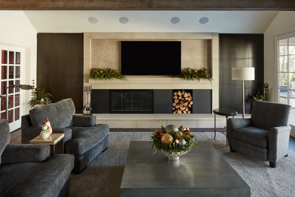 Design ideas for a mid-sized modern open concept family room in Kansas City with grey walls, dark hardwood floors, a wood stove, a stone fireplace surround, a wall-mounted tv and brown floor.