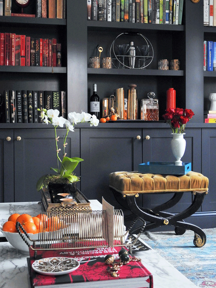 Home office library - mid-sized traditional medium tone wood floor and brown floor home office library idea in New York with gray walls